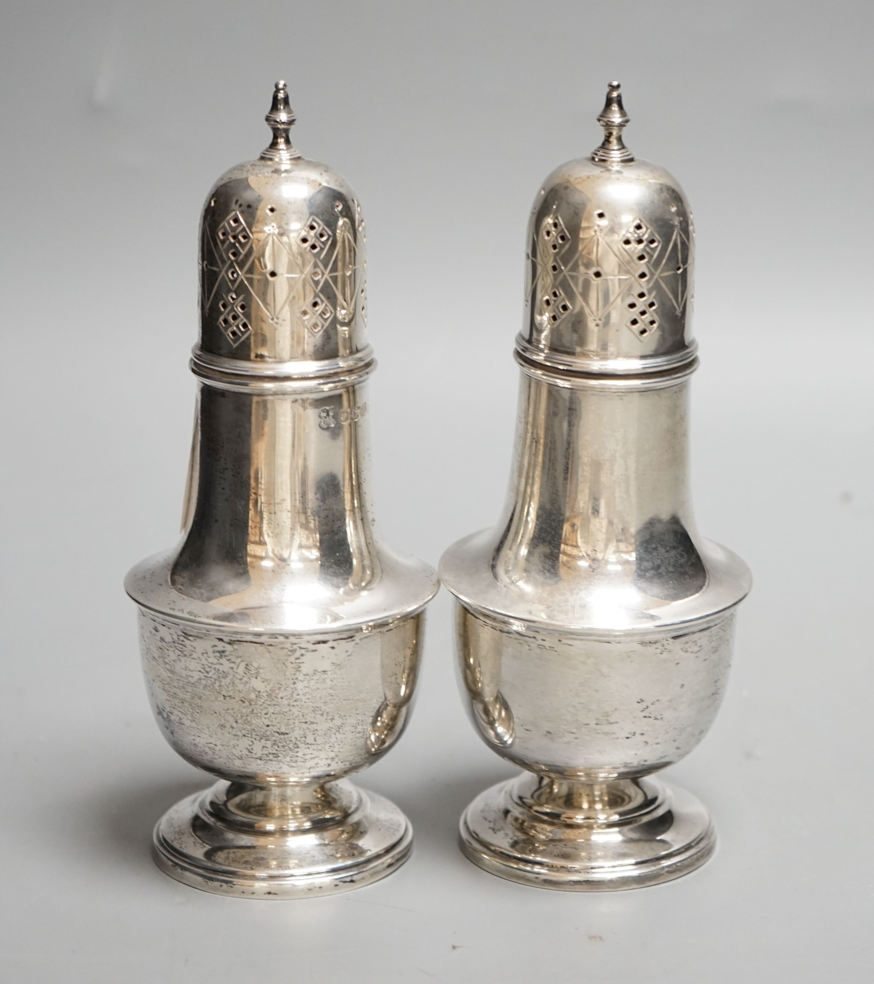 A pair of George VI silver sugar casters, William Batt & Sons, Sheffield, 1937, 17.7cm, 9oz.